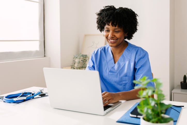 A doctor is happy to have an interpreter with her telehealth meeting.