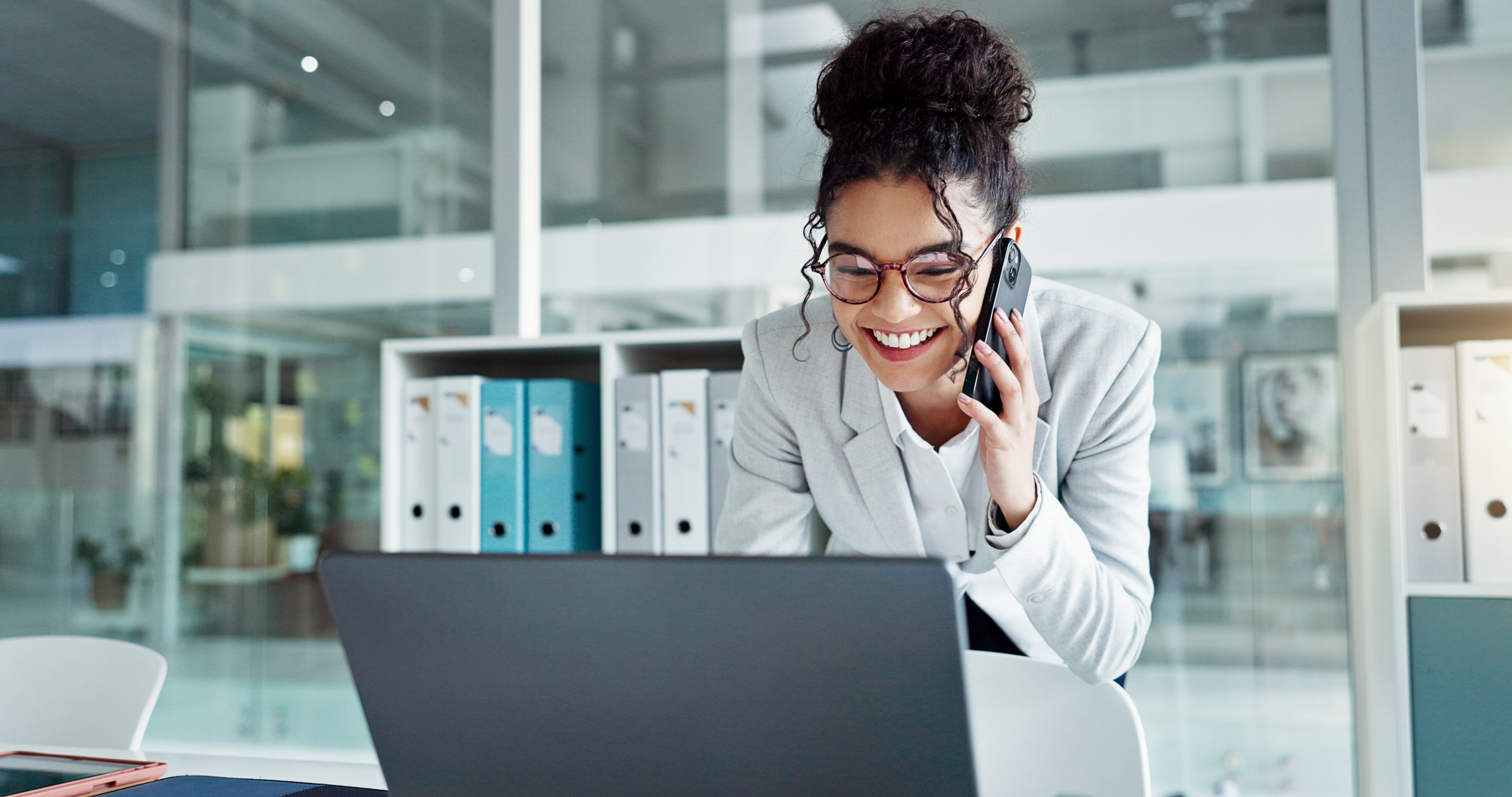 A client smiles as she joins our Automated Interpreter Pilot