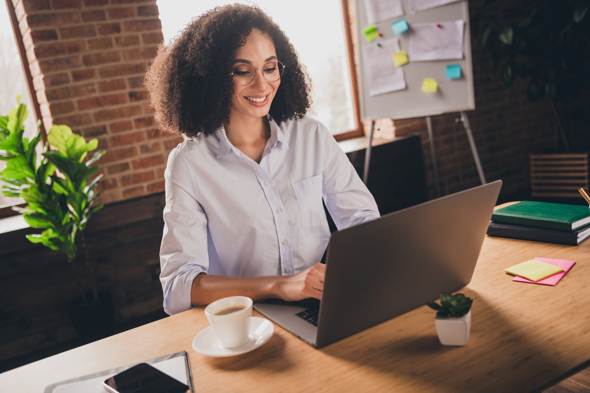 A woman smiles as she submits a document translation request.