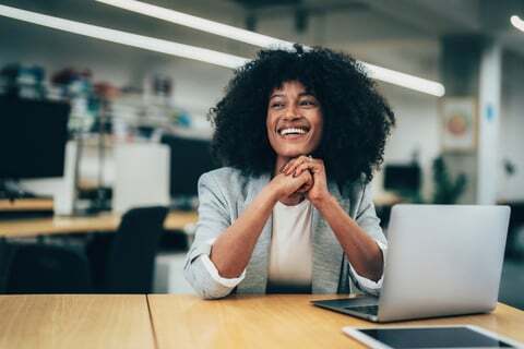 A woman smiles after she submits a project request for document content optimisation