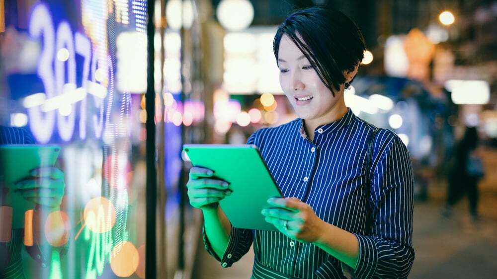 A woman reads a translated financial document