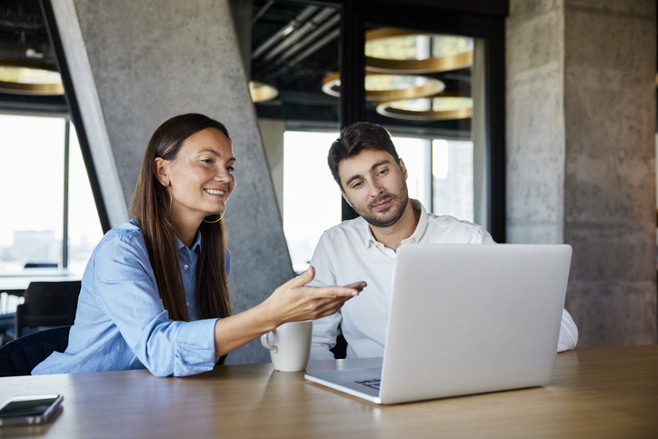 A man and woman are happy to see the fast turnaround for their translation