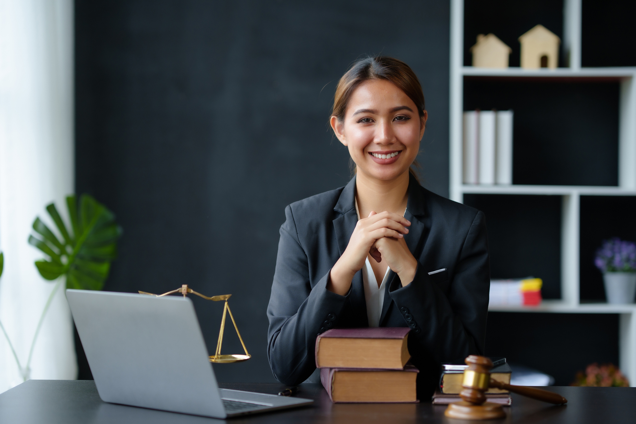 A lawyer smiles as she awaits her next client.