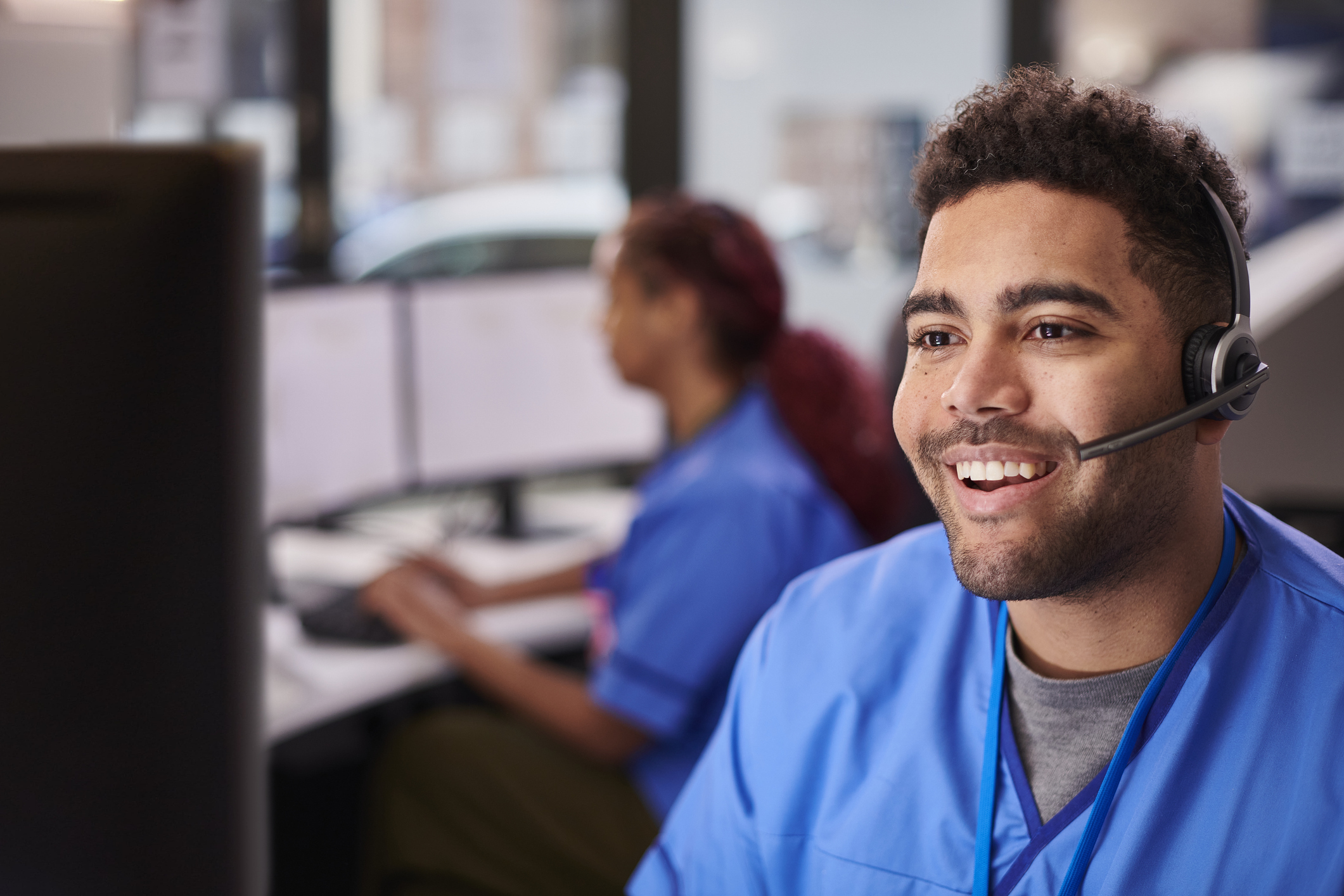 A medical worker schedules an appointment with a patient with the help of the automated interpreter