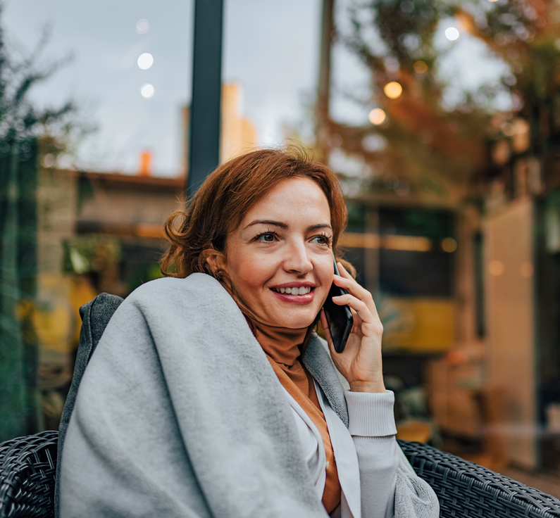 A happy limited English proficient caller connects to a business with an interpreter already on the call.